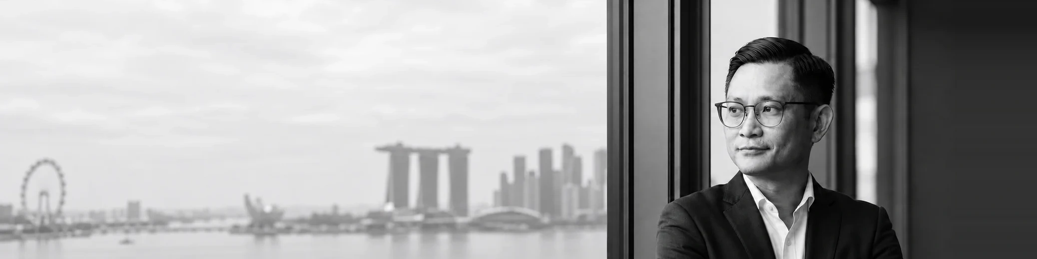 Ziqian by the window, with Marina Bay in the background